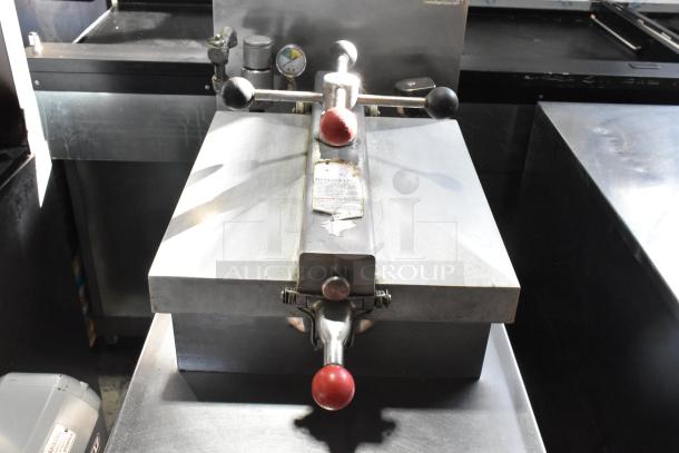 Henny Penny 600 stainless steel pressure fryer, natural gas, 80,000 BTU, on commercial casters, with control panel and safety labels.