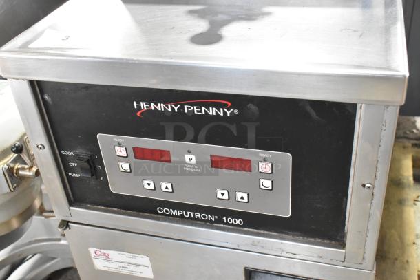Henny Penny 600 stainless steel pressure fryer, natural gas, 80,000 BTU, commercial casters, digital controls visible.