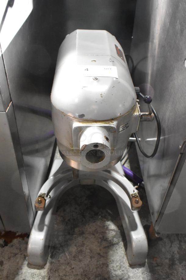 Hobart A120T commercial 12-quart dough mixer, metal, 115V, 1 phase. Visible wear, model label, countertop design.