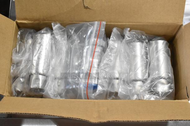 Box containing stainless steel components for Cooking Performance Group CPG GT-CPG-72-NL griddle, wrapped in plastic.