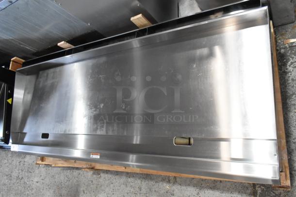 Brand new 2025 Cooking Performance Group 72" stainless steel griddle, 180,000 BTU, thermostatic controls, minor scratches.
