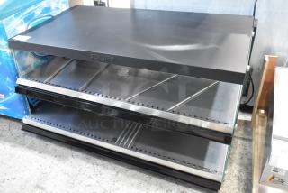 Brand new ServIt OAM-138D 48" slanted 2-shelf heated display merchandiser. Minor scratches, 120V, 1-phase, model 423OAM138D.