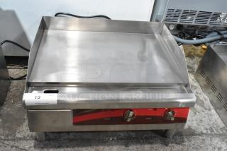 Brand new Avantco 177EG24N stainless steel electric countertop flat top griddle, 208/240V, minor scratches and dents visible.
