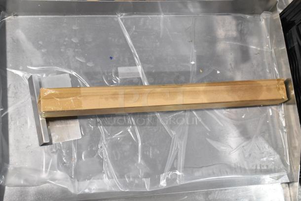 Brand new Avantco 177EG24N stainless steel electric countertop griddle, 208/240V, shown with protective packaging.