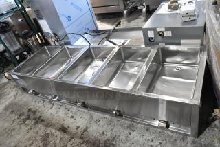 Brand new ServIt 423EST5WSFB stainless steel electric steam table, five pan capacity, sealed wells, enclosed base, 240V.