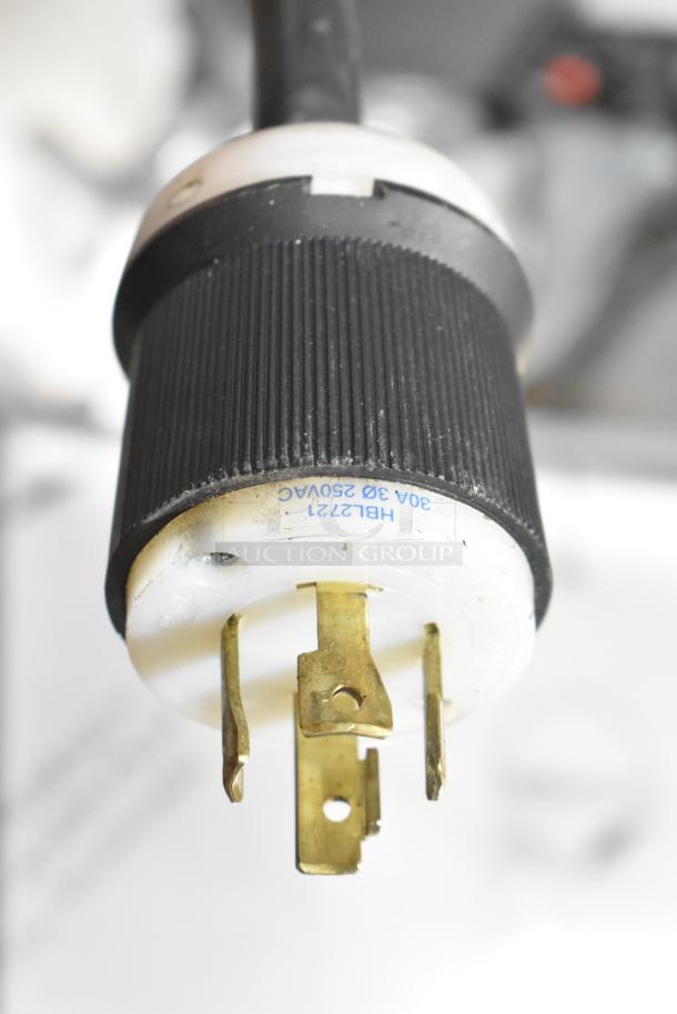 Close-up of a plug for a 2021 Precision HD-60 floor style 60-quart planetary dough mixer, showing voltage details.