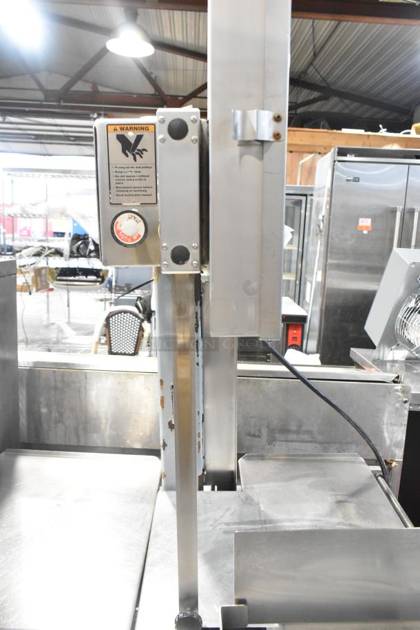 Hobart commercial metal meat saw, floor style, minor rust on column, warning label visible, steel construction.