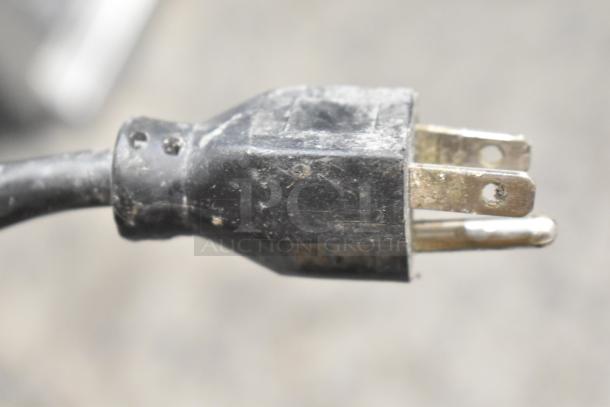 Power plug of Hobart Legacy HL200 20 Quart Planetary Dough Mixer, showing a standard three-prong design.