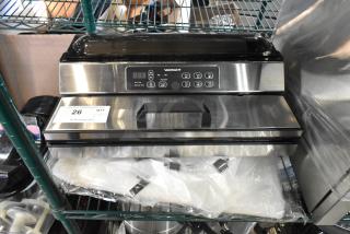 Brand new VacPak-It 186VME16SS stainless steel vacuum packaging machine, 16" seal bar, 120V, with control panel, minor dents.