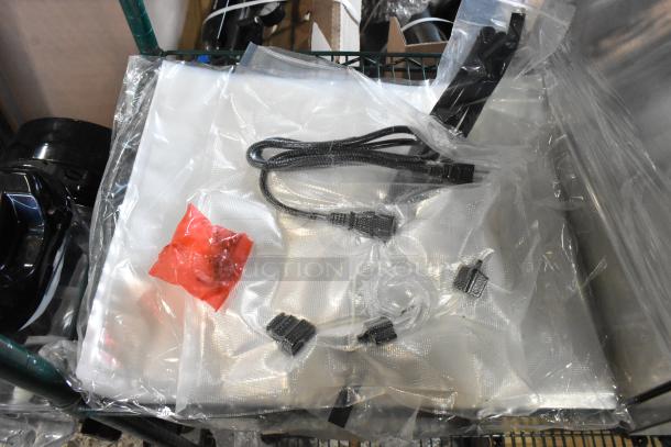 Brand new VacPak-It 186VME16SS vacuum machine, 16" seal bar, 120V, 1 phase, in packaging with accessories shown.