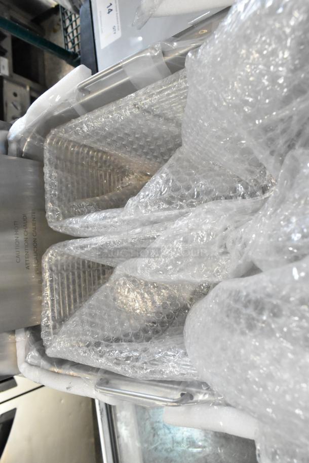 Brand new Vollrath CF2-1800 stainless steel countertop deep fryer with 2 metal fry baskets, wrapped in bubble wrap.