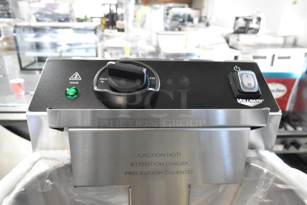 Brand new Vollrath CF2-1800 deep fryer, stainless steel, 10 lb capacity, 120V, with control panel and caution markings.