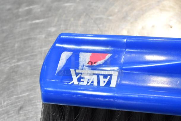 Lavex 14" blue push broom head with gray flagged bristles, featuring brand label and partial sticker residue.