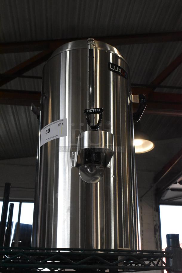 BRAND NEW Fetco TPD-30 Luxus stainless steel 3-gallon coffee dispenser; scratch and dent condition, model label visible.