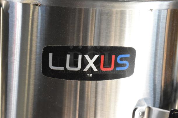 BRAND NEW Fetco TPD-30 Luxus 3 Gallon Coffee Dispenser, stainless steel, label visible, scratch and dent condition.