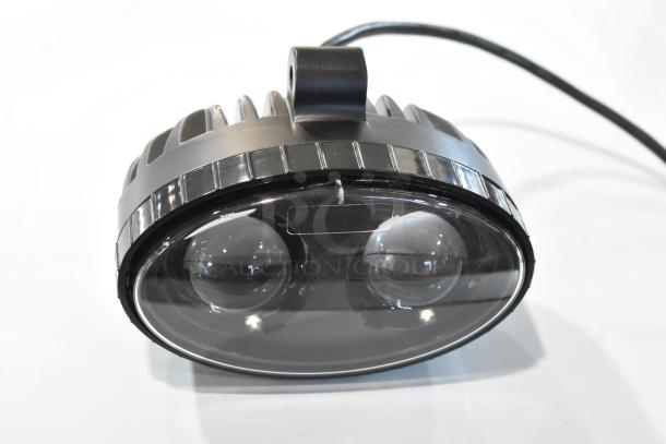 Brand new scratch and dent Ideal Warehouse Forklift Rear Spotter 70-1095, black housing, dual lenses, visible cable.