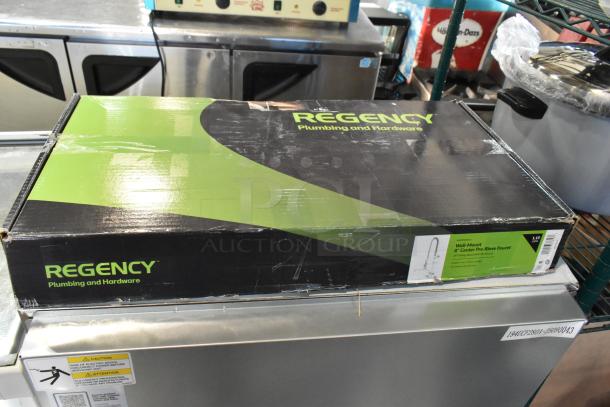 Box of a Regency 1.15 GPM wall-mounted pre-rinse faucet with 8" centers and 14" add-on faucet. Shows brand logo and specs.