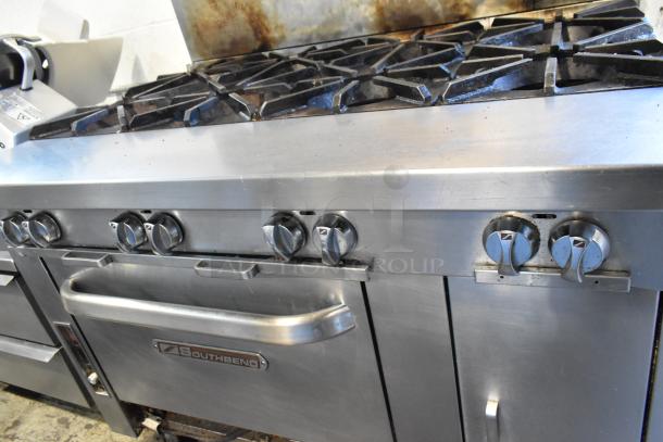 Southbend stainless steel commercial 8 burner range with oven, on commercial casters, visible Southbend label, in used condition.