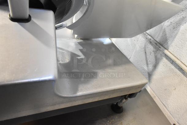 Bizerba GSP HD metal commercial meat slicer; countertop model, 120 volts, 1 phase, showing blade area and sturdy build.