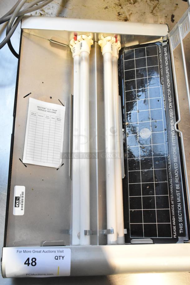 Metal Bug Zapper, 120 Volts, 1 Phase, with two fluorescent tubes and fly trap service record attached. Good condition.