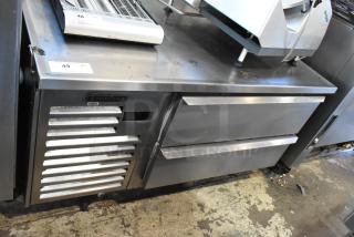 Traulsen stainless steel 2 drawer chef base on commercial casters, 115 volts, 1 phase, visible brand logo.