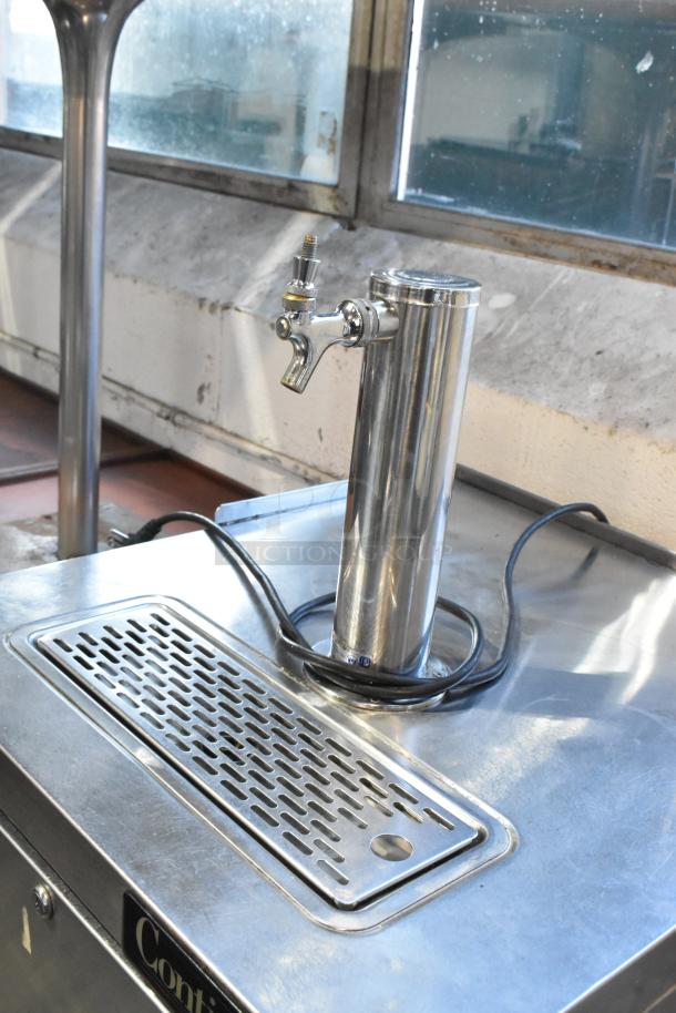 Continental stainless steel commercial kegerator with beer tower, 115 volts, on casters. Locked door, includes drip tray.