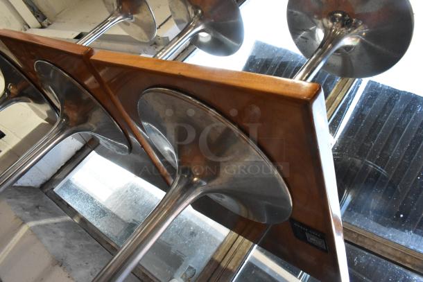 Nine dining tables with chrome finish bases, wooden tops. Excellent condition, ideal for modern dining spaces.