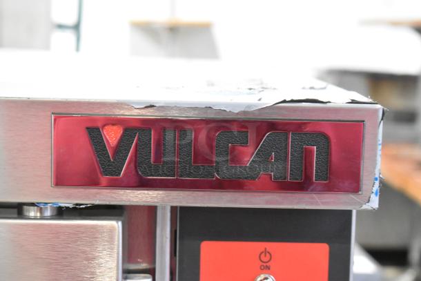 Brand new Vulcan VC5ED stainless steel convection oven with view-through doors, metal racks, and thermostatic controls.