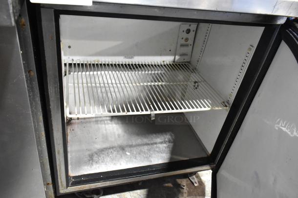 True TWT-27F stainless steel commercial single door freezer, shows interior with shelf, used condition, 115 Volts, 1 Phase.