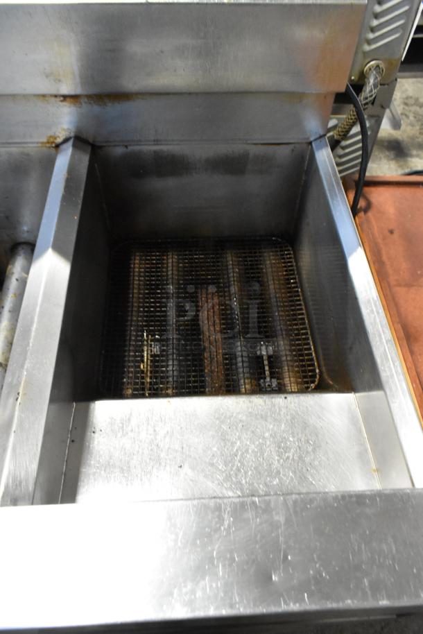 2019 Frymaster SCFSM250GN stainless steel 2-bay natural gas fryer, 120,000 BTU, on commercial casters, used condition.