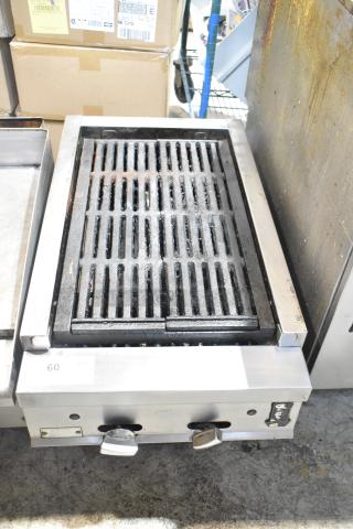 Montague stainless steel commercial countertop gas charbroiler grill, dual control knobs, used condition, model details unknown.