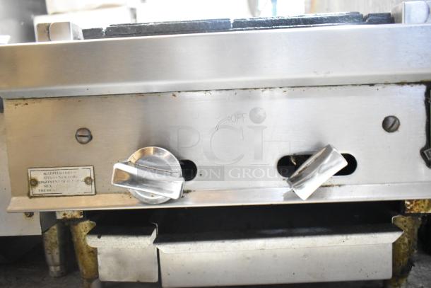 Montague stainless steel commercial gas charbroiler grill, features control knobs and markings, in used condition.