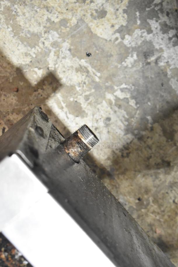 Montague Stainless Steel Gas Charbroiler Grill with visible gas fitting; shows signs of rust and wear.