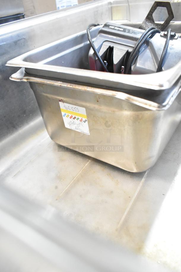 Lot of metal baking pans, bowls, and utensils. Visible label reads "BEETS." Items show signs of wear.