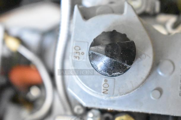 Close-up of a control dial labeled "OFF" and "ON" on the 2023 Pitco Frialator SSPG14 Pasta Cooker, 60,000 BTU, stainless steel.