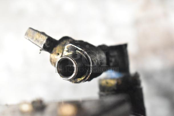 Close-up of a metal valve part from the Pitco Frialator SSPG14 pasta cooker, highlighting its industrial design.