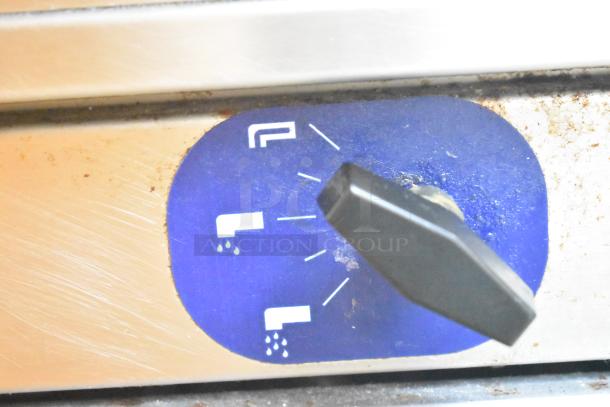 Close-up of a control knob on a 2023 Pitco Frialator SSPG14 stainless steel commercial pasta cooker, showing settings.