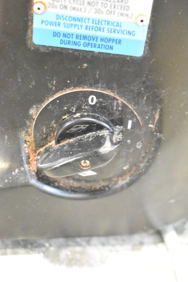 Mazzer Luigi Major Electronic Espresso Grinder, black control dial with on-off markings, visible wear, and warning labels.