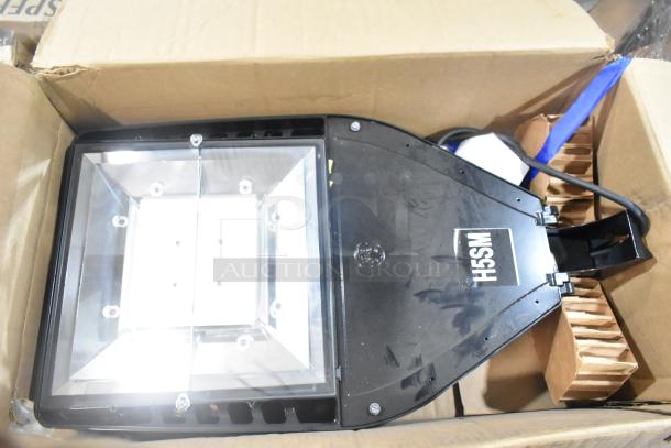 Brand new General Electric H5SM light unit in box, labeled "H5SM," unused condition, includes six boxes for auction.