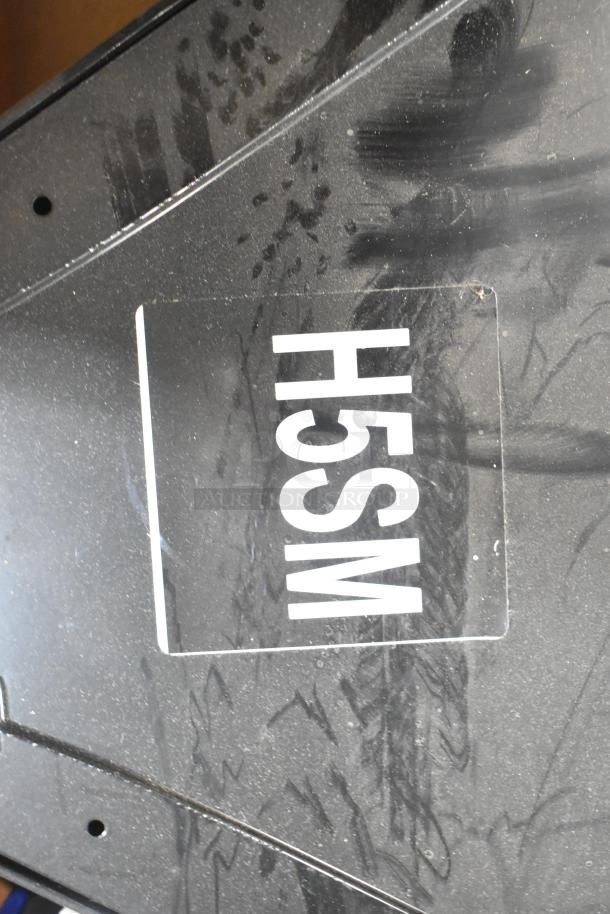 Brand new box with General Electric H5SM marking, containing Dual Lite LED emergency light; pristine condition.