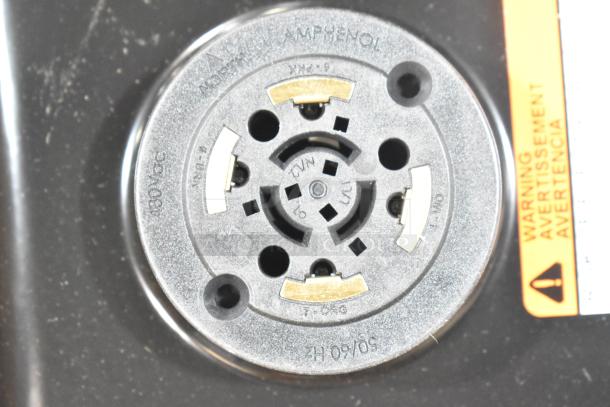 Close-up of a socket labeled "Amphenol" on a new GE H5SM Light box. Warning label partially visible on the right.