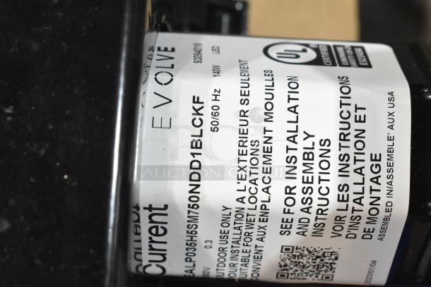Close-up on label of a General Electric H5SM light, showing model NDD1BLCKF, UL certification, and installation details.