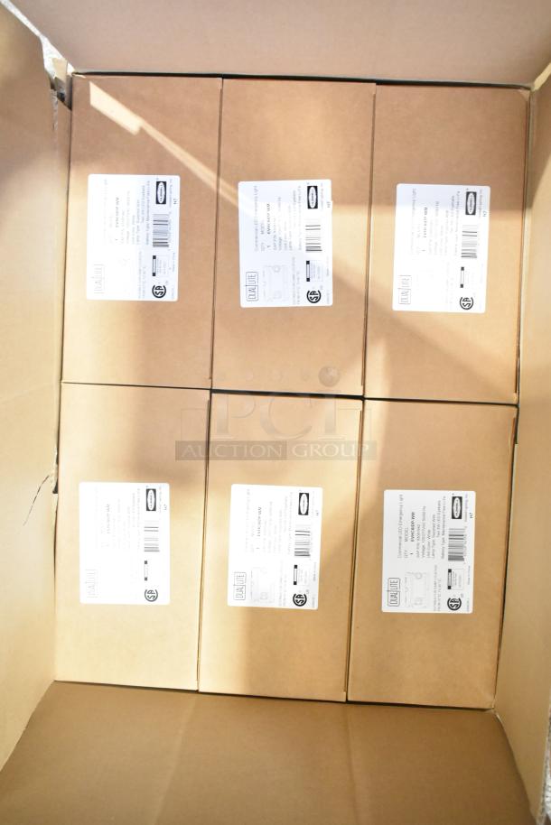 Six brand new boxes containing General Electric GE H5SM lights and Dual Lite LED emergency lights. Sealed packaging with visible labels indicating model and specifications.
