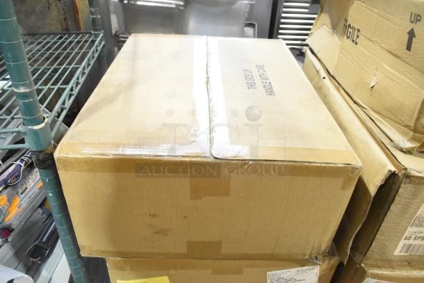 Boxes containing Dual Lite EVHCEZP Emergency Light Back Box; labeled "This Side Up, Handle with Care." Mint condition.