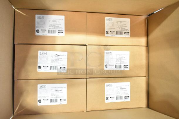 12 new Dual Lite EVHCEZP emergency light boxes, labeled for commercial use, suitable for damp locations.