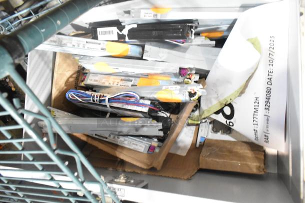 Lot of various ballasts in mixed condition, including multiple types and wiring, some with visible labels and markings.