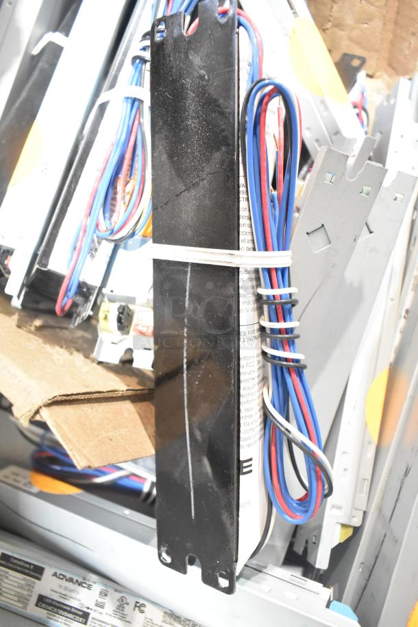 Lot of various ballasts with wiring, mixed brands and models, visible labels on some indicating specifications, used condition.