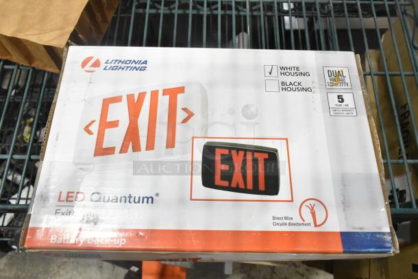 7 brand new Lithonia Lighting exit signs, LED Quantum model, in white housing, dual voltage, battery backup, 5-year warranty.