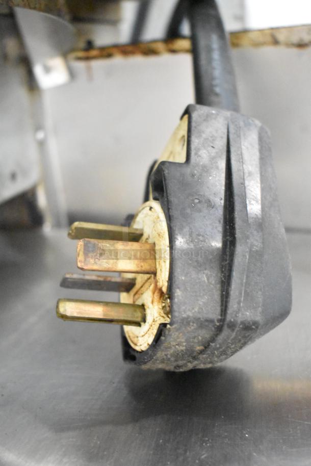 Turbochef HhC2020 oven plug, showing a three-phase electrical connector, slight wear visible.