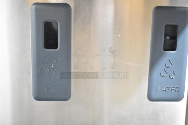 2018 Scotsman HID312A-1A stainless steel commercial countertop nugget ice machine and water dispenser with hands-free dispensing.